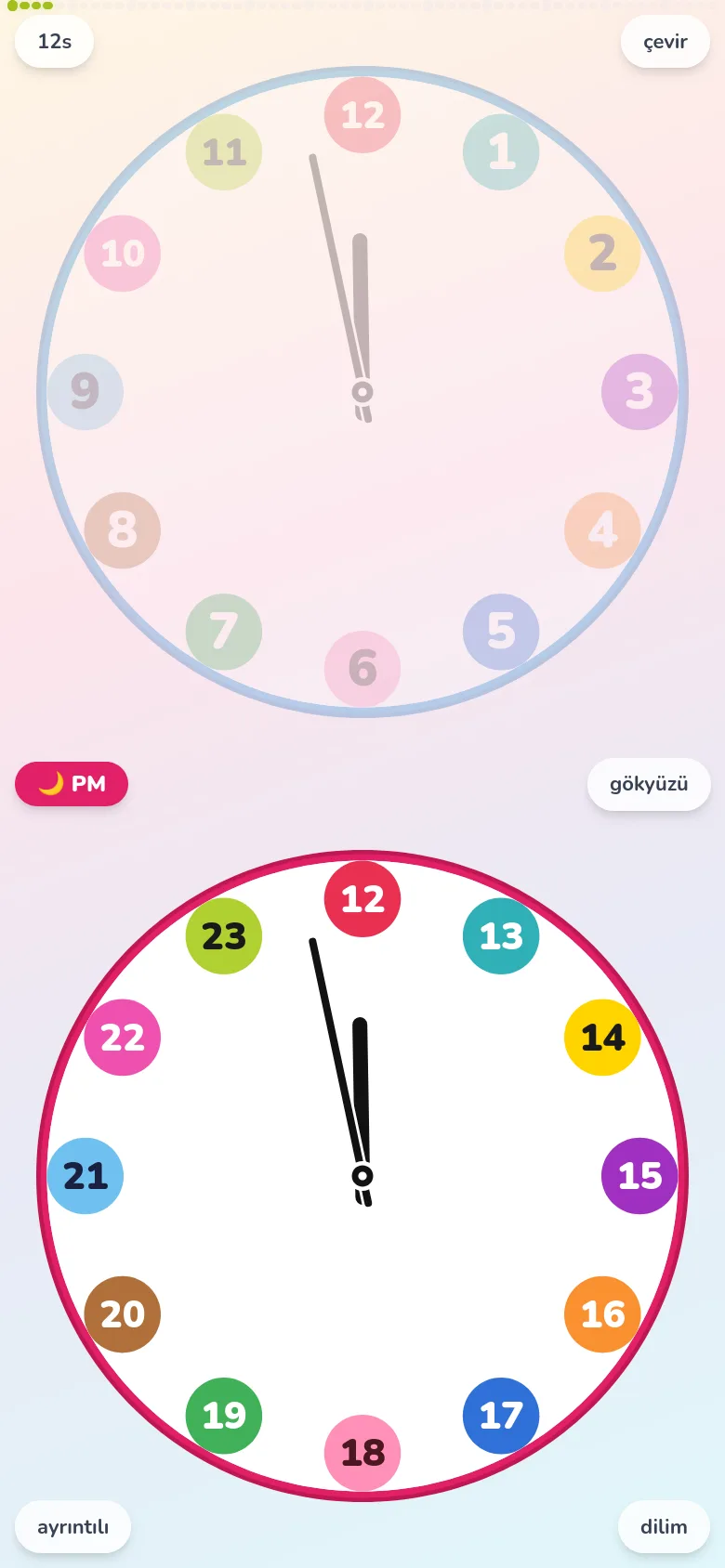 Futatoki the clock en sade yapısıyla açılmış ekran. Dış halkadaki dakika rakamları gizli; büyük renkli rozetler 1-12, altta PM 13-23 olarak sıralı.